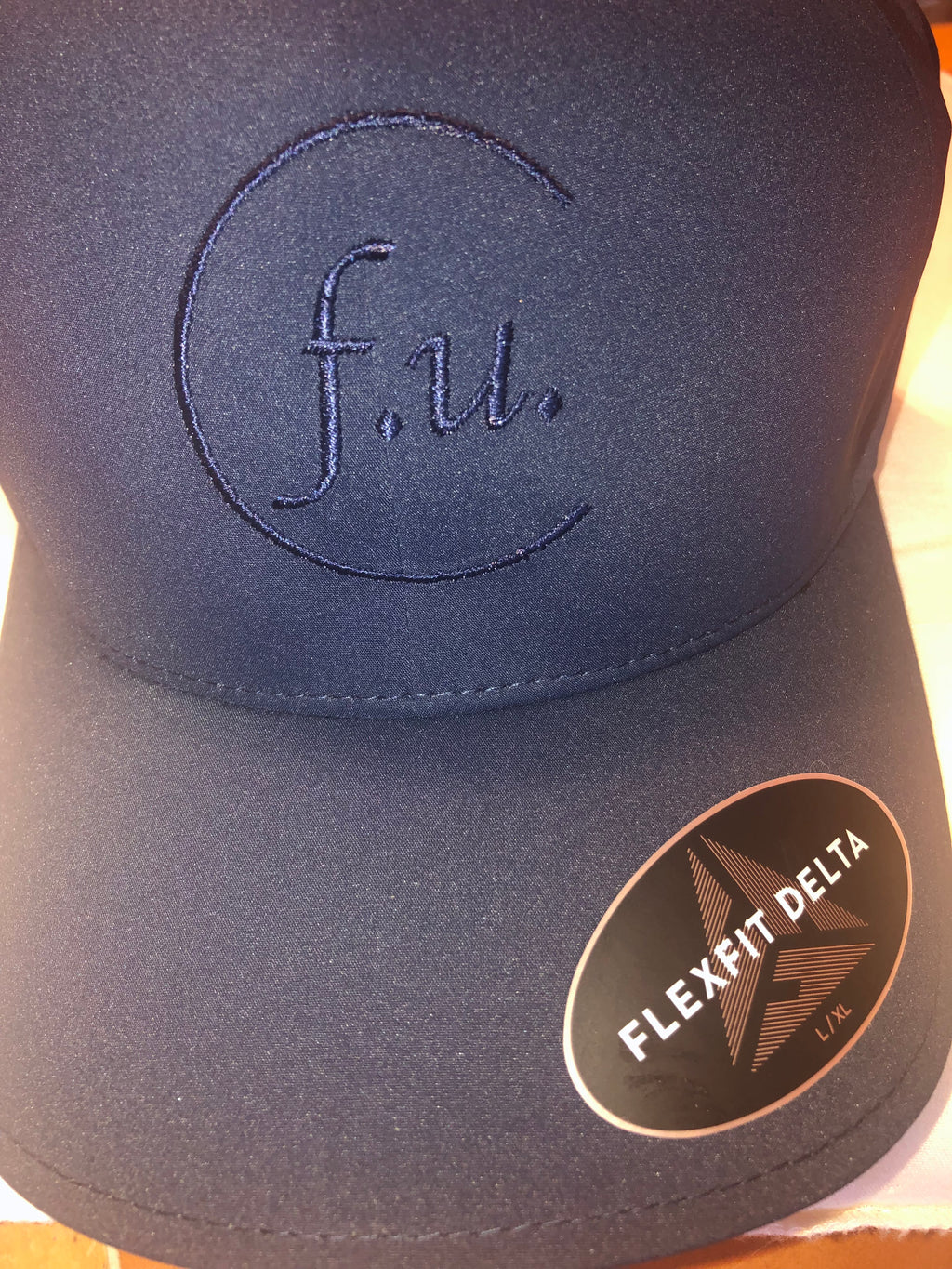 Navy blue fitted f.u. hat tone stitch. small/med and large / xl